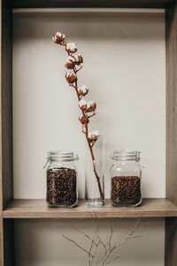 Wine glass in jar on table at home