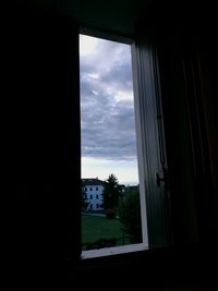 Cloudy sky seen through window