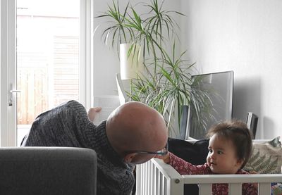 Close-up of father and daughter at home