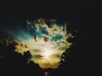 Low angle view of silhouette trees against sky during sunset