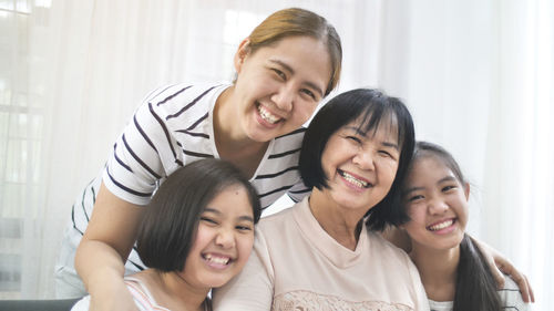 Portrait of happy family at home