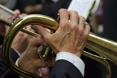 Close-up of man playing trumpet