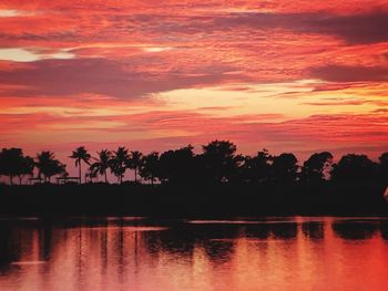 Scenic view of lake at sunset