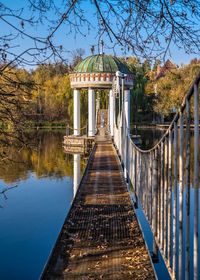 Gazebo in the middle of the lake on a sunny autumn evening in the village of ivanki, ukraine