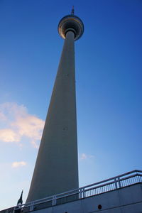 Low angle view of tower against blue sky