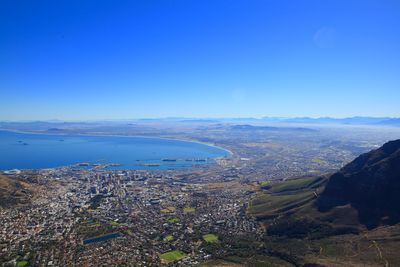 High angle view of cityscape against clear blue sky