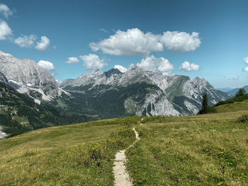 Scenic view on an alpine path of mountains in the karwendel landscape against sky