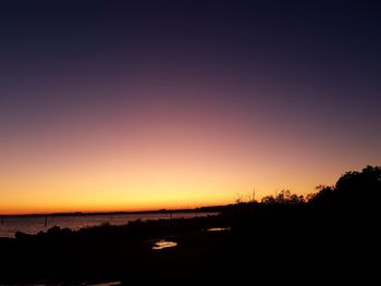 Scenic view of silhouette landscape against romantic sky at sunset