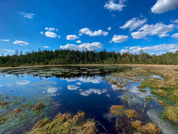 Scenic view of swamp and  lake against sky with clouds in upper bavaria