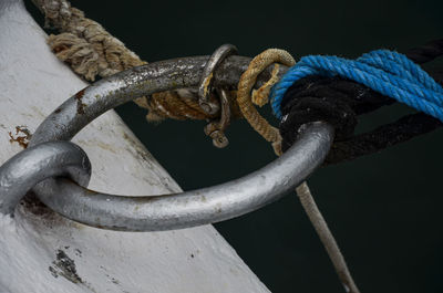 Close-up of rope tied on rusty metal