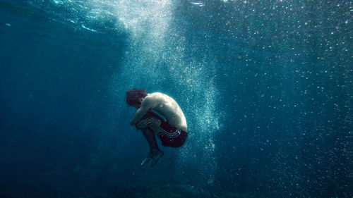 Man swimming in sea