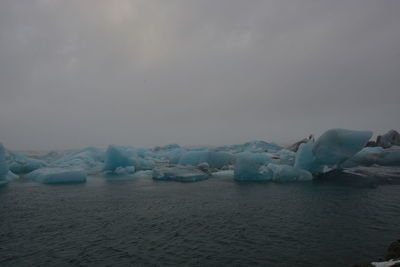 Scenic view of frozen sea against sky