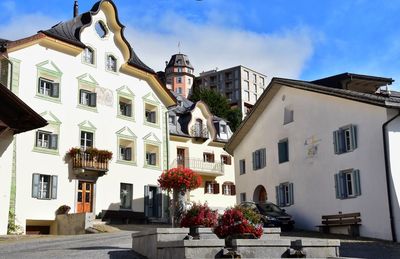 Houses against sky in city