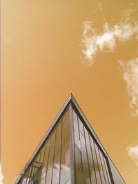 Low angle view of building against sky at sunset