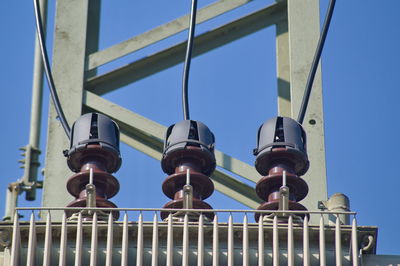 Low angle view of street light against clear blue sky