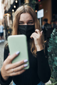 Young woman using mobile phone