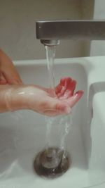 Close-up of woman drinking water