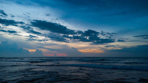 Scenic view of sea against sky at sunset