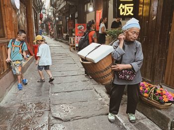 Full length of friends on walkway