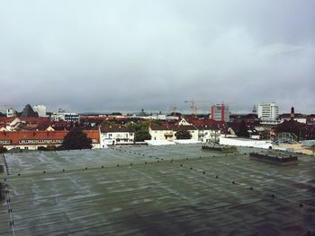 Buildings against cloudy sky