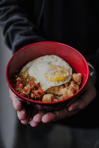 Close-up of man holding bowl