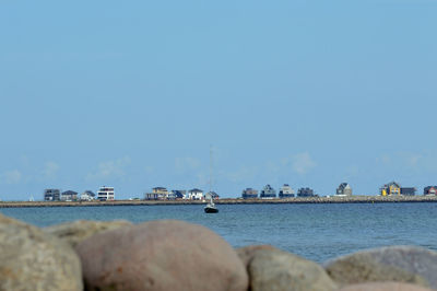 Panoramic view of sea against clear blue sky