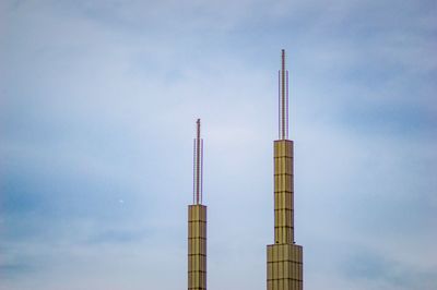 Low angle view of smoke stack against sky