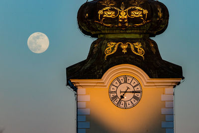 Low angle view of clock tower against sky