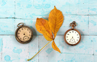 Directly above shot of old pocket watches on table