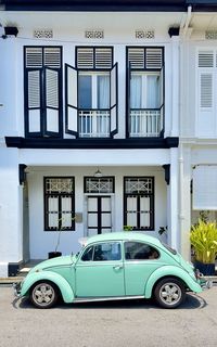 Vw beetle car on shophouse street