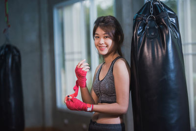 Portrait of smiling female boxer