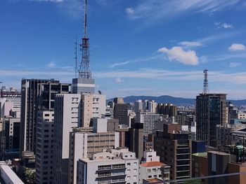 Modern buildings in city against sky