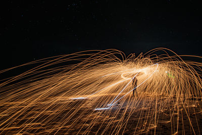 Light trails against sky at night