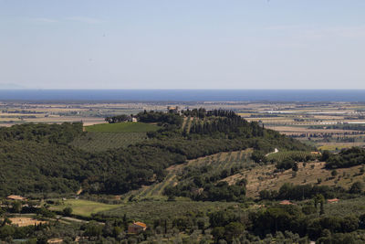 High angle view of landscape and sea against sky