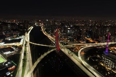 High angle view of light trails on highway at night