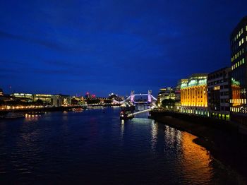 Illuminated city at waterfront