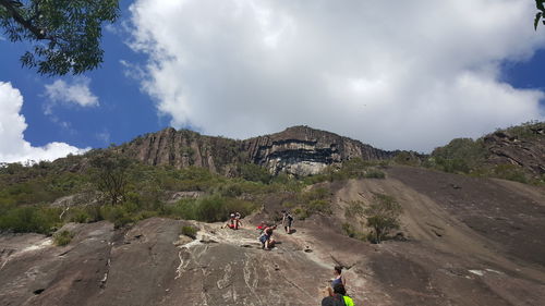 Scenic view of mountains against cloudy sky