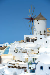 Low angle view of traditional building against clear blue sky