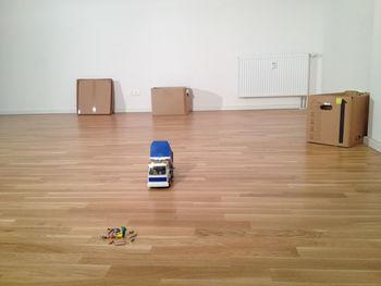 Toys and crayons on hardwood floor
