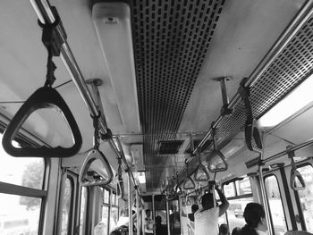 Low angle view of people in train