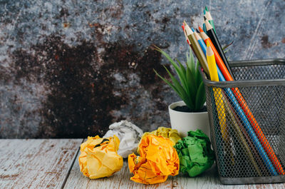 High angle view of multi colored umbrella on wooden table