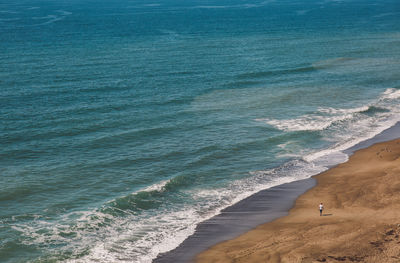 High angle view of man standing on beach