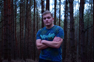 Portrait of young man in forest