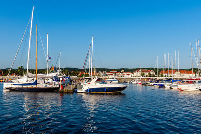 Sailing yachts moored on a pier in a harbour on baltic sea. nautical vessel for charter