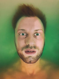 Close-up portrait of man in bathtub