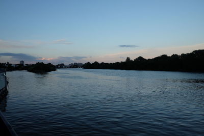 Scenic view of lake against sky during sunset