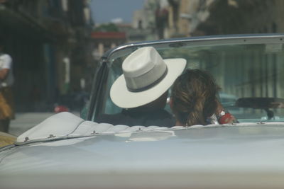 Rear view of woman in car