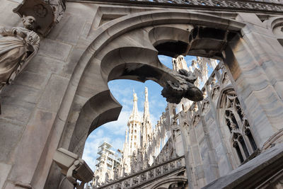 Low angle view of milan cathedral in city