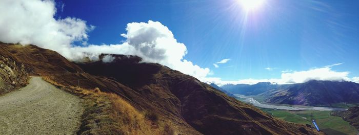 Scenic view of mountains against cloudy sky