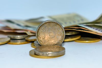 Close-up of coins and paper currency